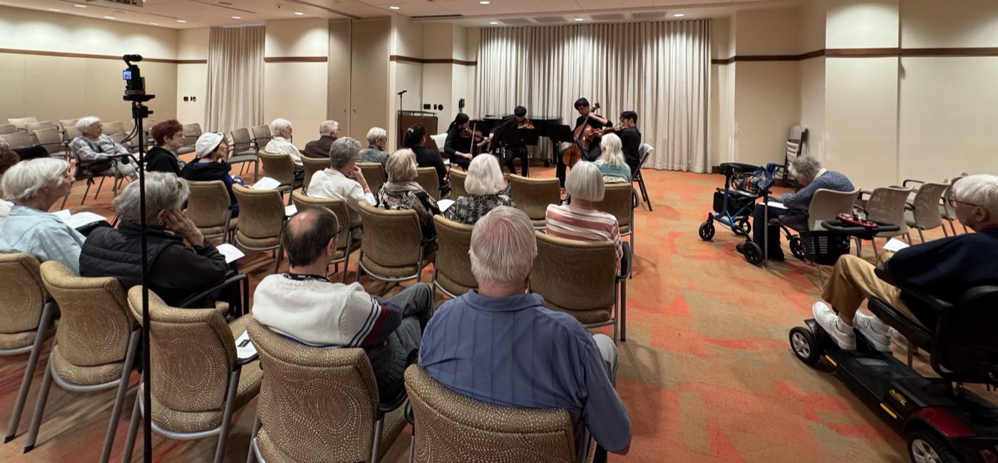 Youth musicians performing for a community audience